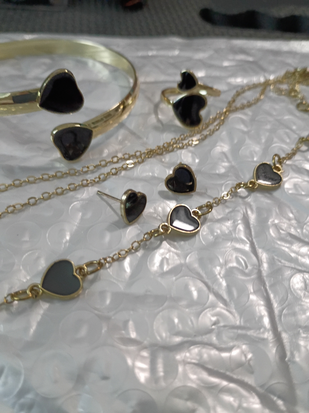 Gold Heart Bracelet with Black Enamel Accents